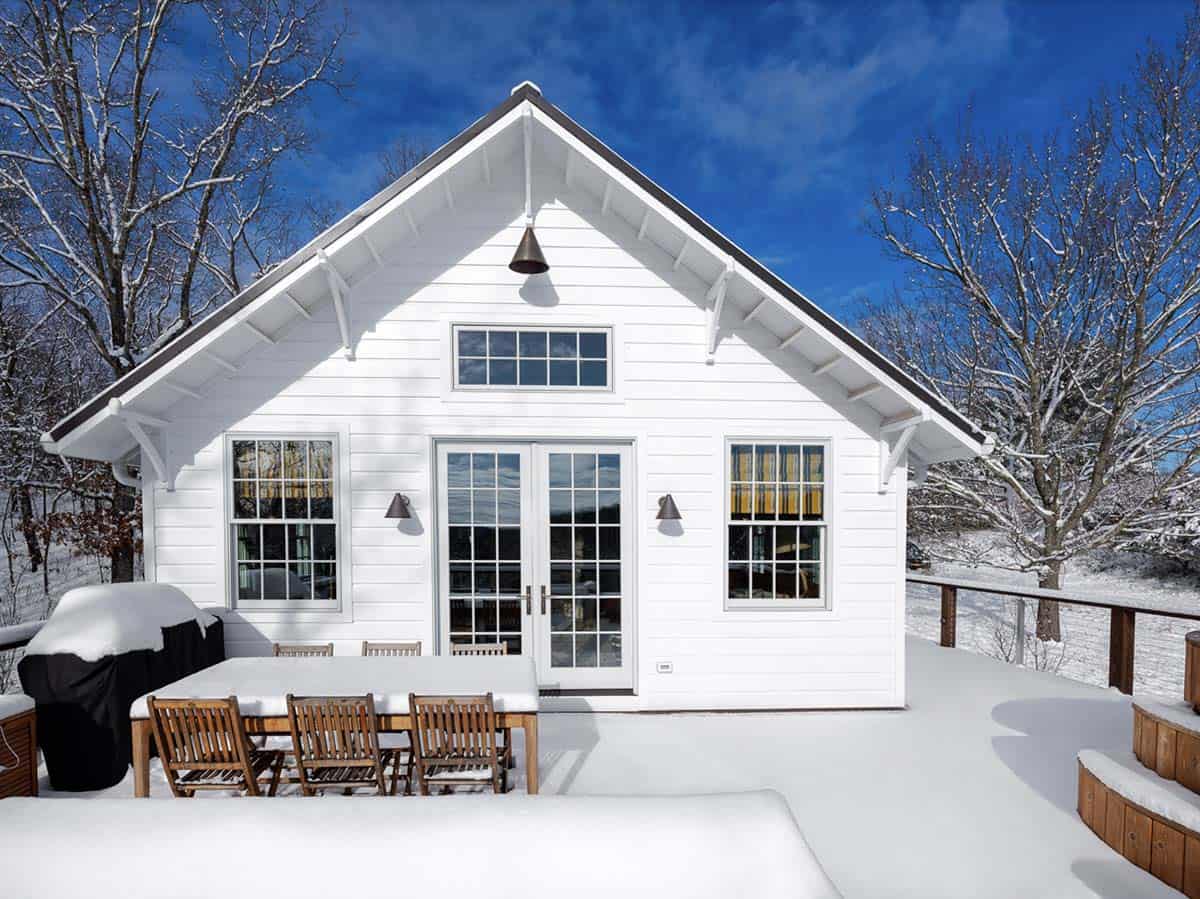 rustic cottage exterior back porch with snow