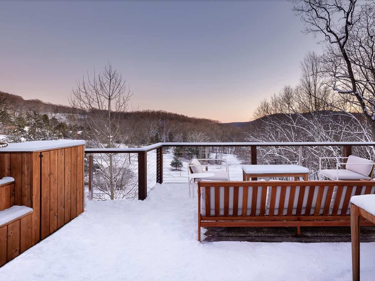 rustic cottage exterior back porch with snow