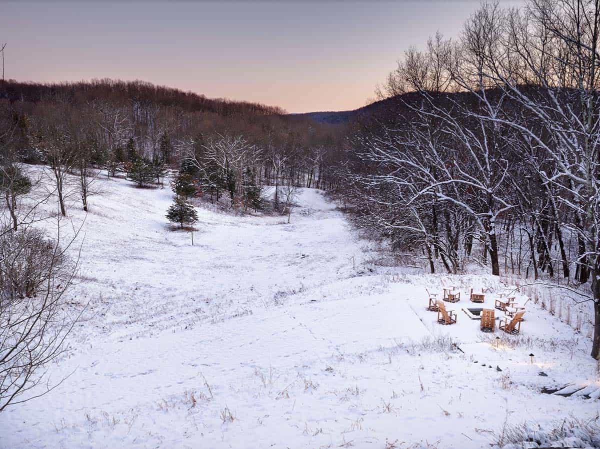 rustic cottage exterior landscape with snow