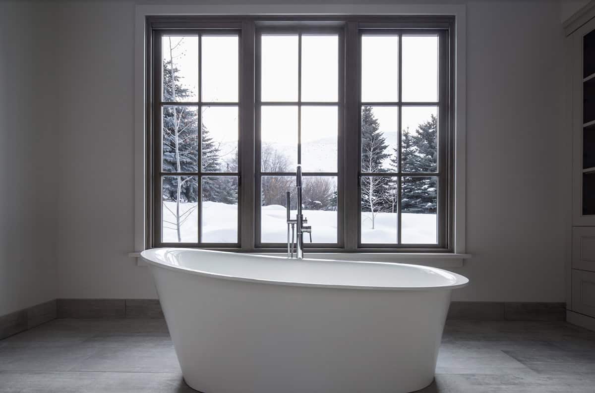 modern rustic bathroom with a freestanding tub
