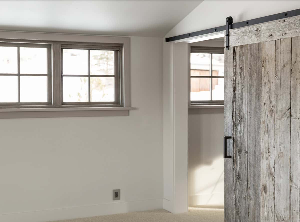 modern rustic hallway with a sliding barn door