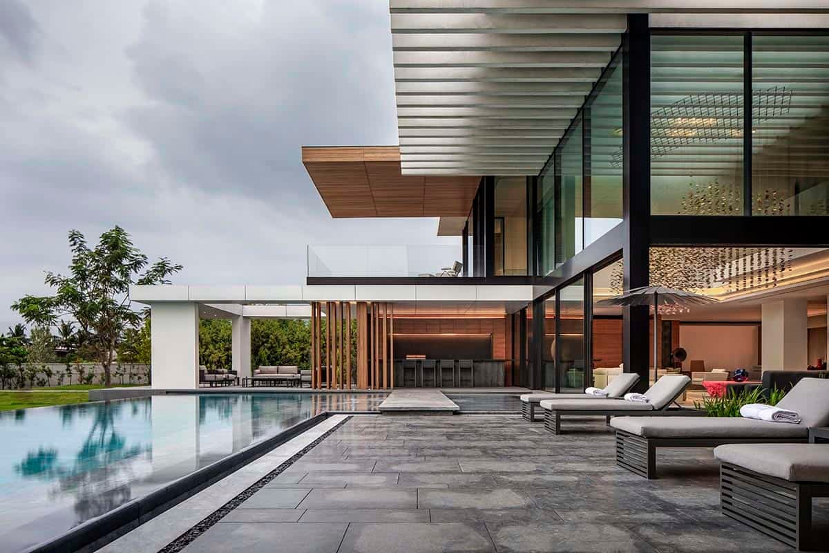 modern waterfront home exterior with a pool