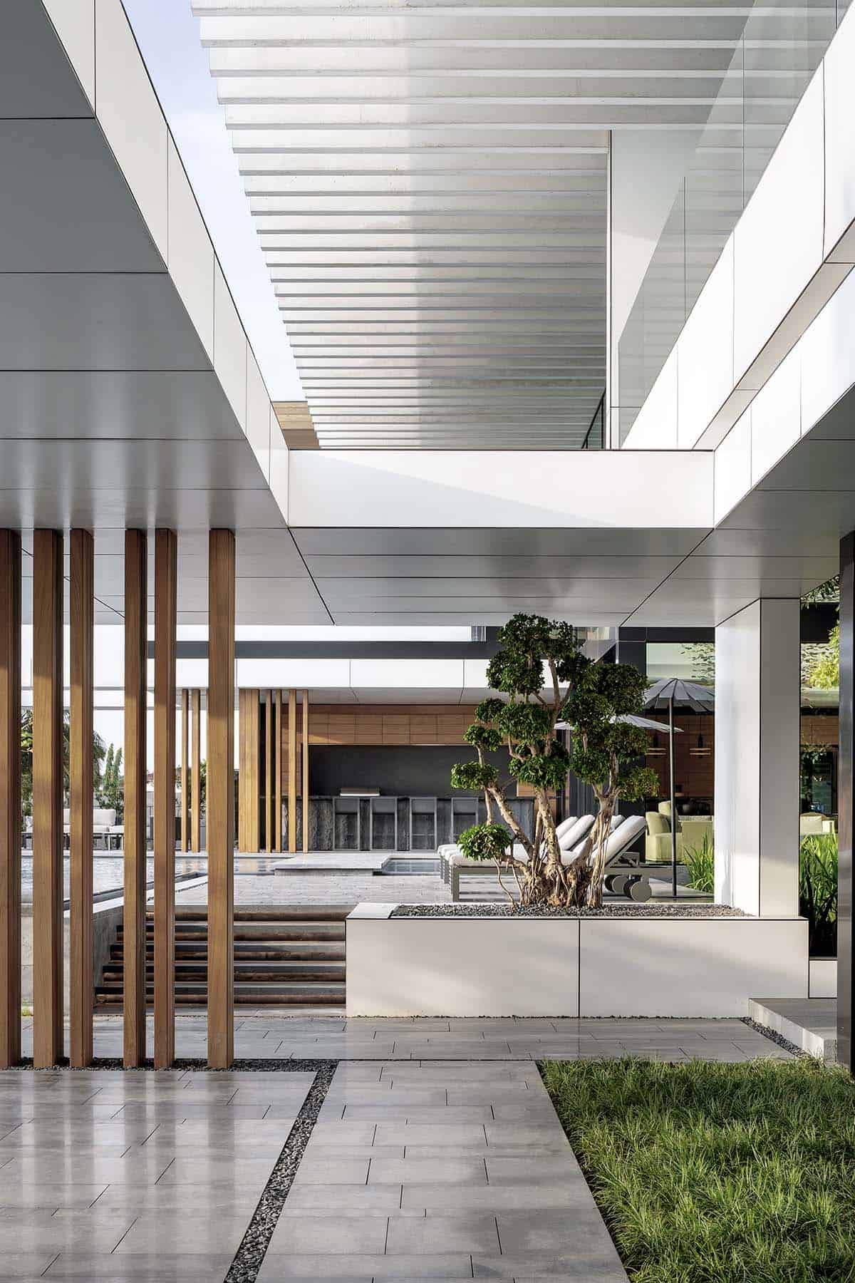 modern waterfront home exterior with a courtyard