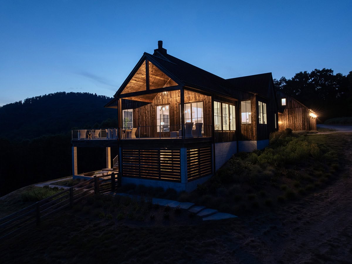 mountain farmhouse style home exterior at dusk
