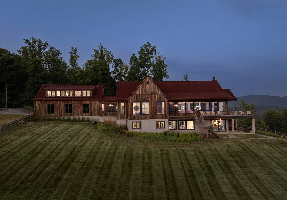 mountain farmhouse style home exterior at dusk