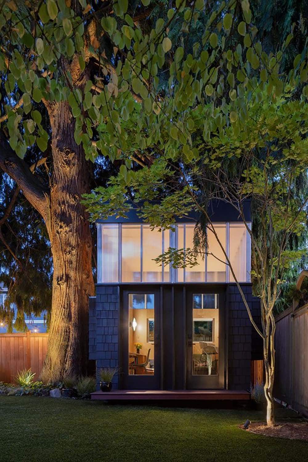 backyard home office exterior at dusk