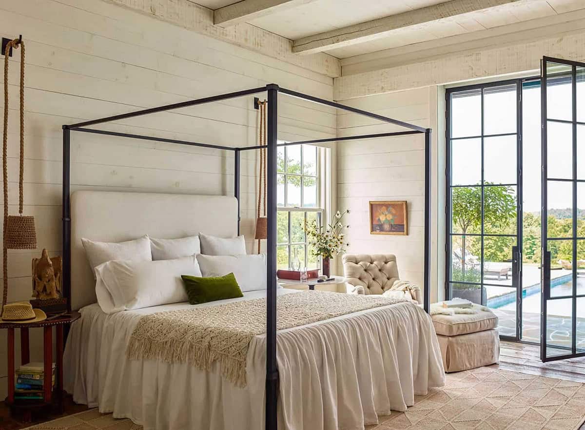 barn style home bedroom with a canopy bed