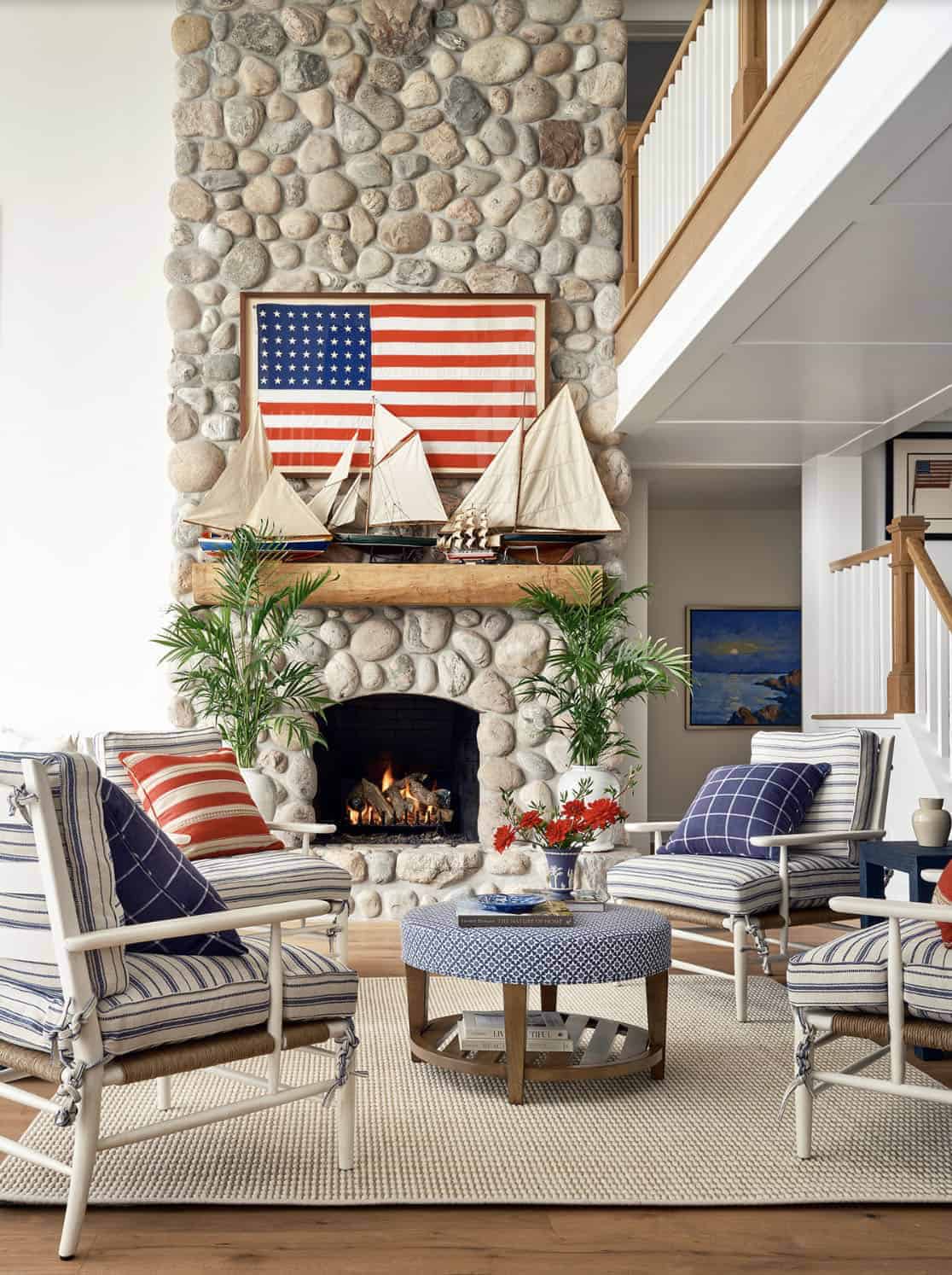 beach style living room with a fireplace