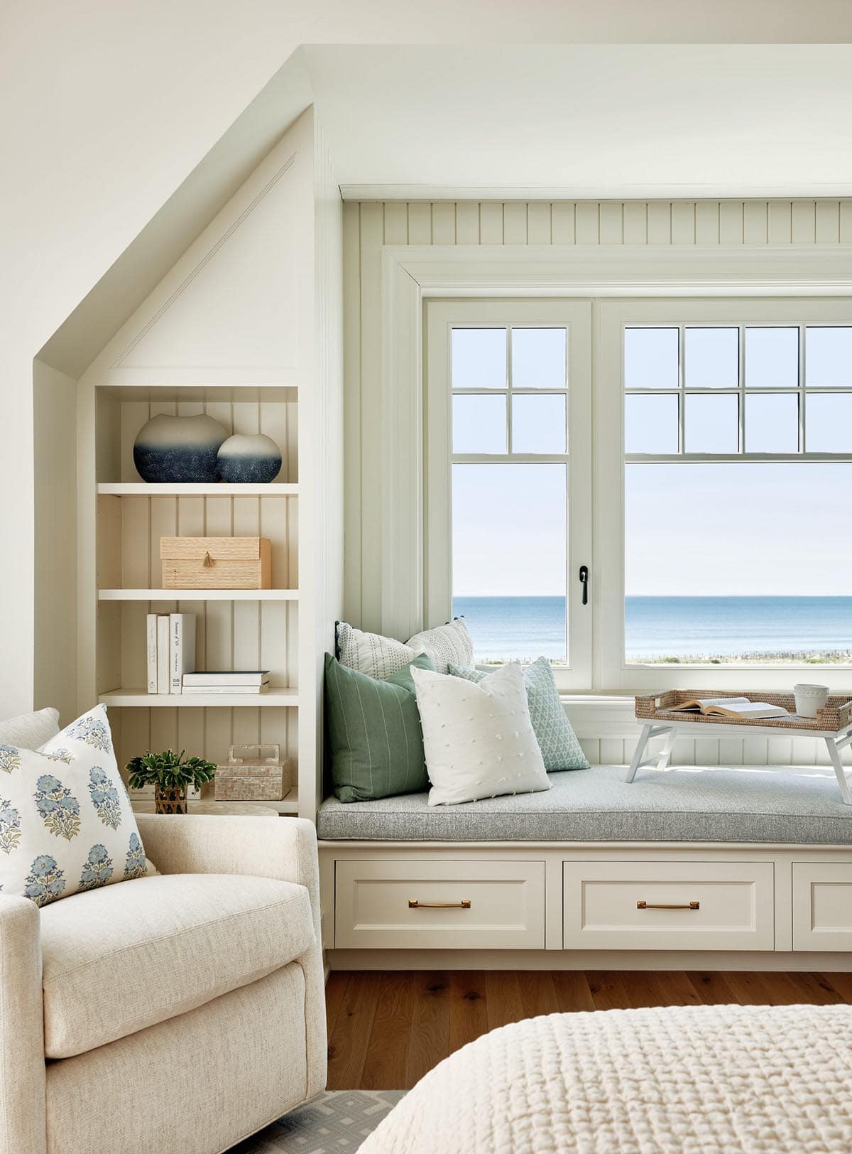Beach Style Bedroom with a built-in window seat