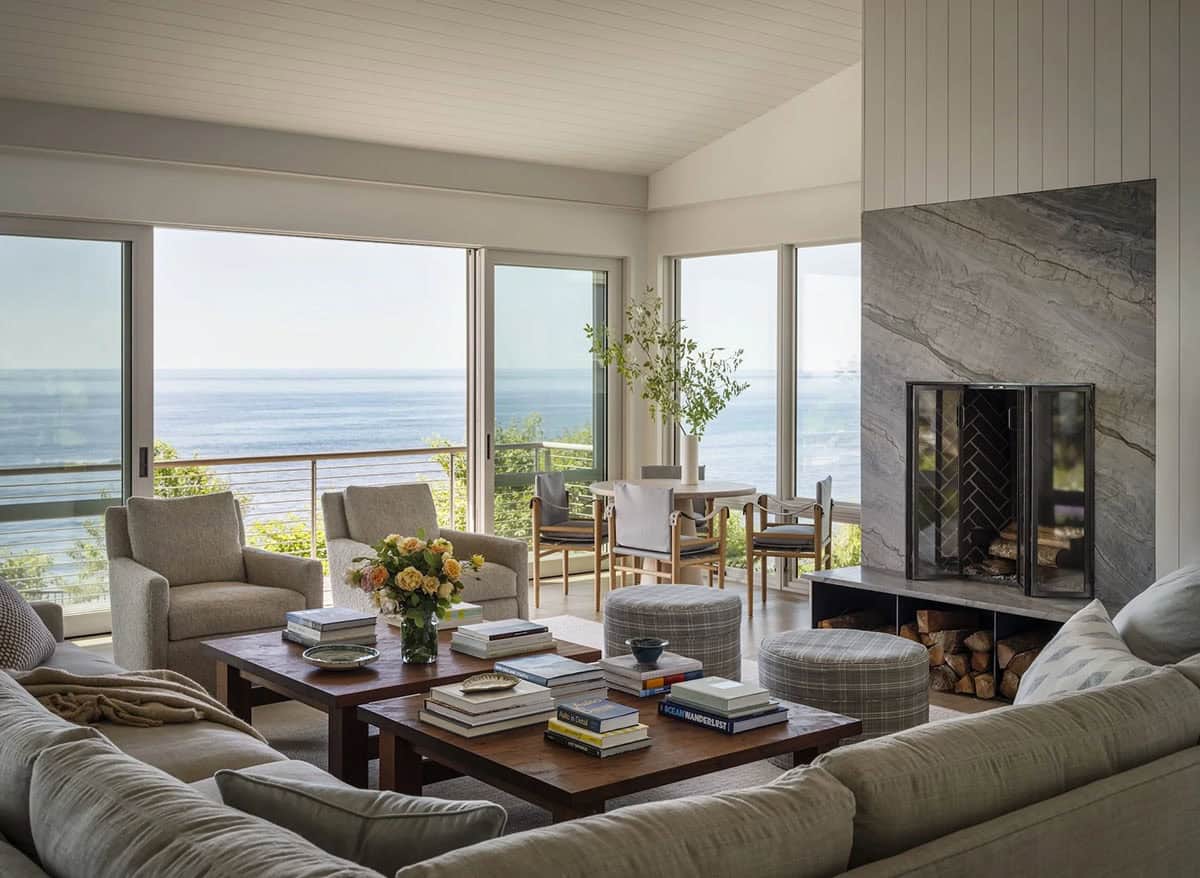 beach style living room with a fireplace