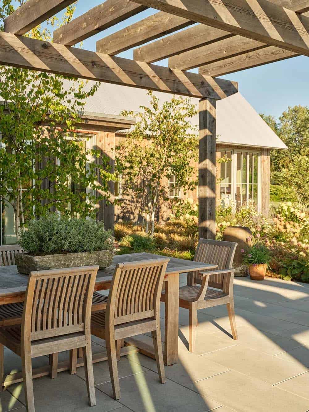 contemporary farmhouse exterior with a pergola patio