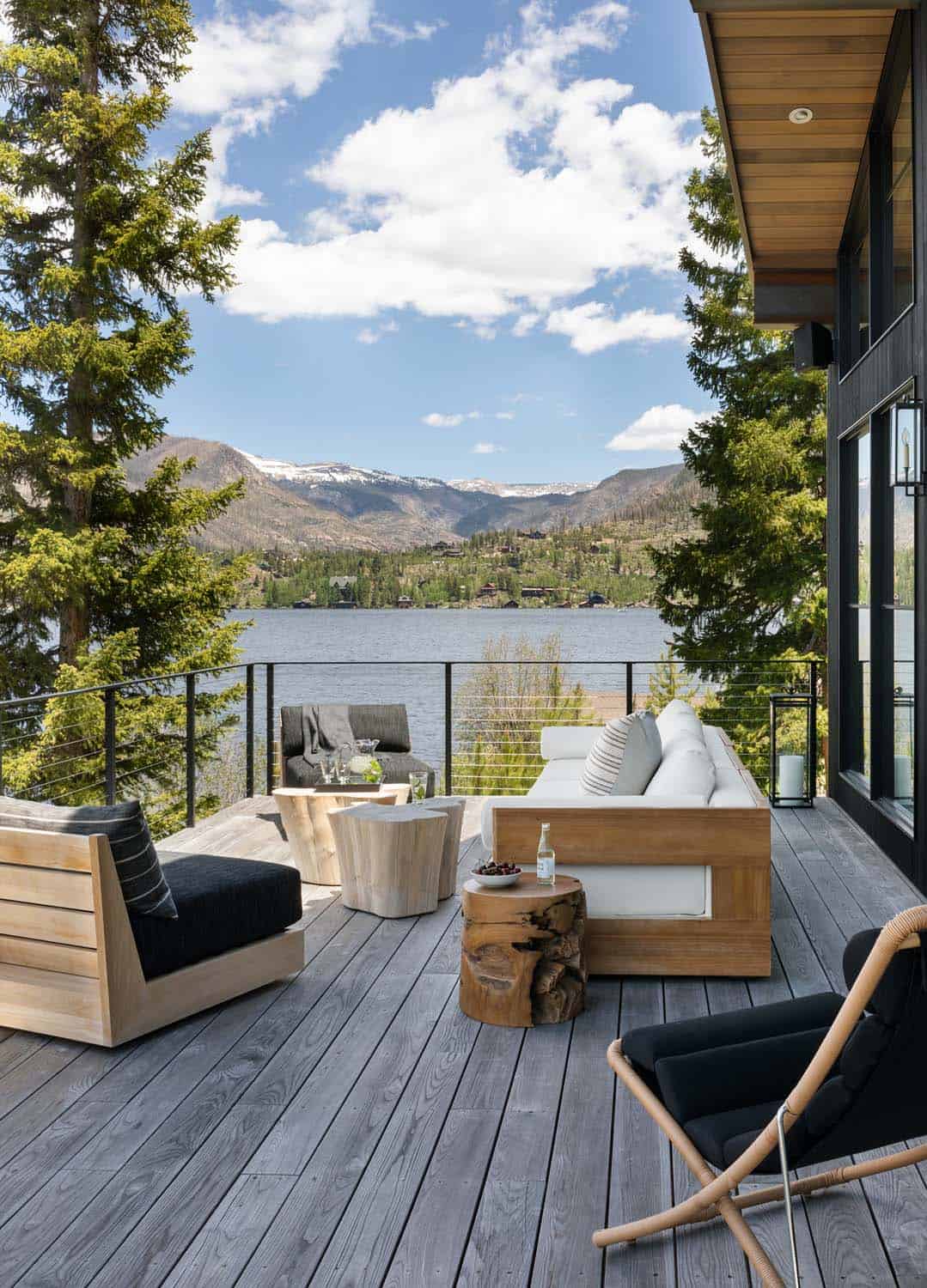 contemporary mountain lake house exterior deck with outdoor furniture
