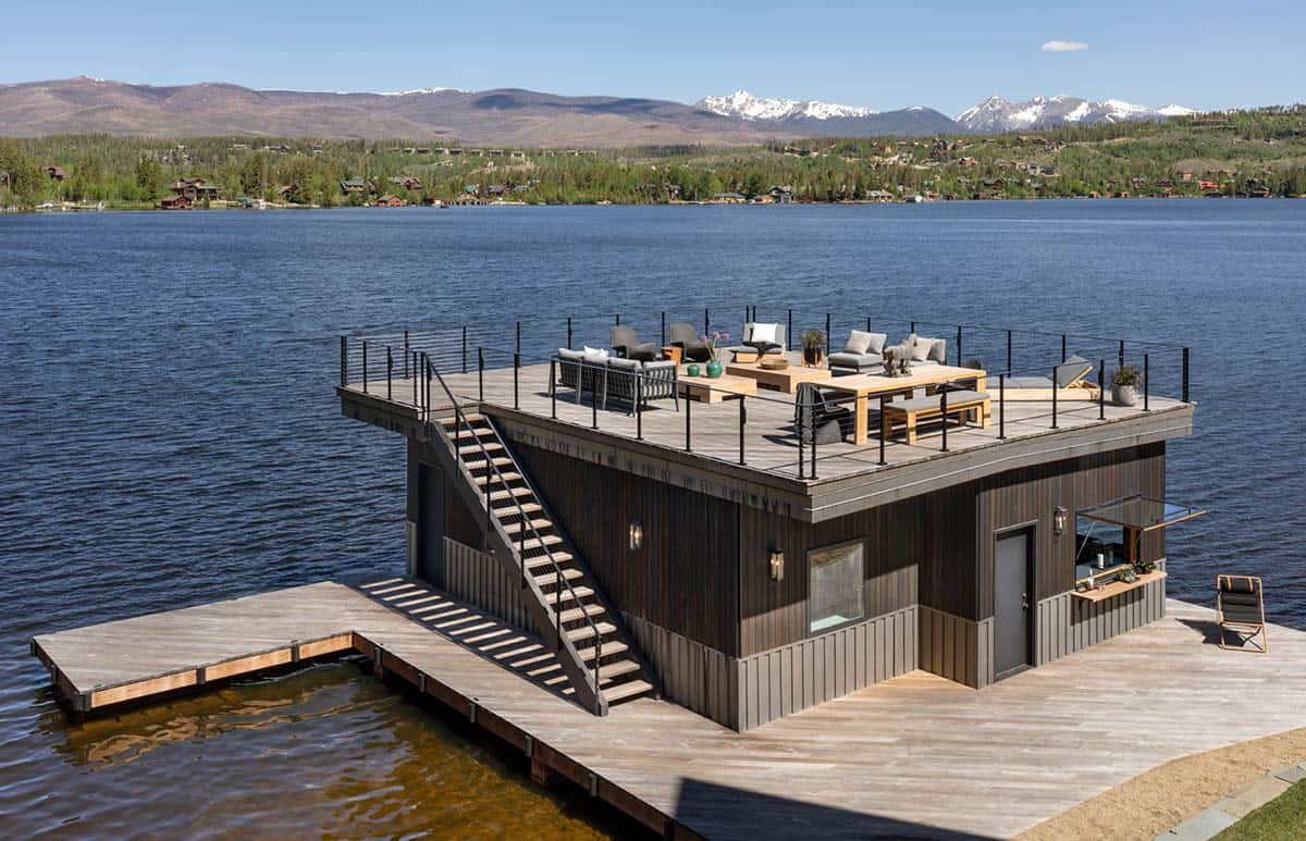 contemporary mountain lake house exterior with a boat house