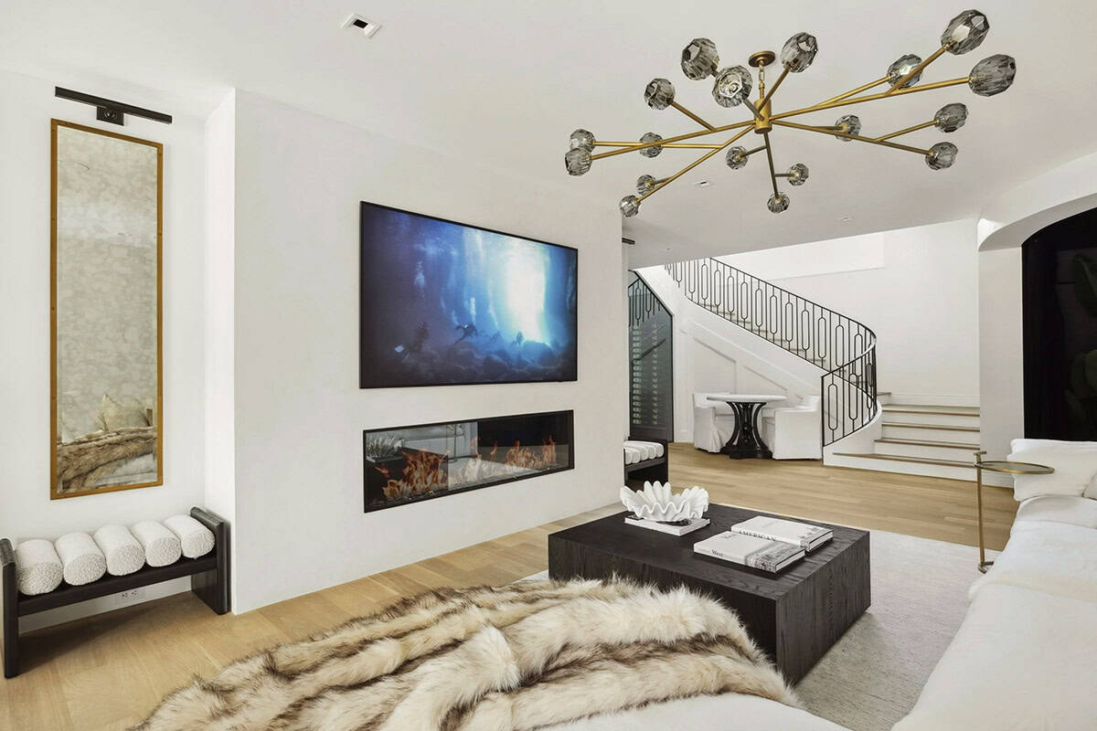 contemporary family room with a fireplace