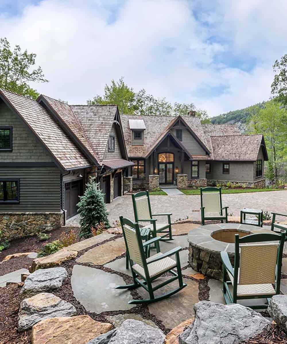 contemporary mountain home exterior with a patio and fire pit