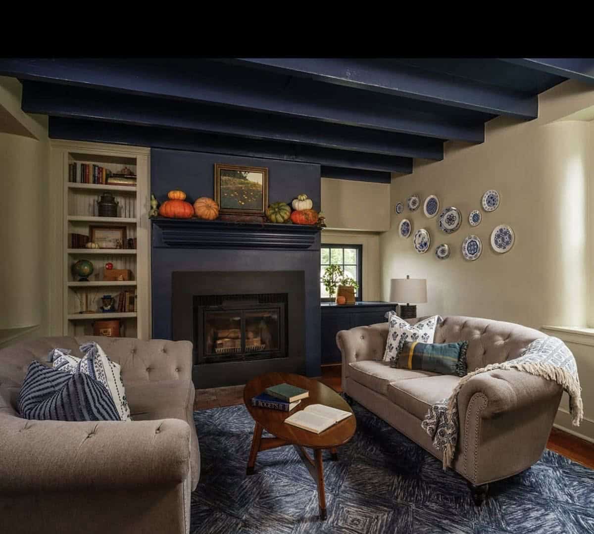 farmhouse style living room with a fireplace