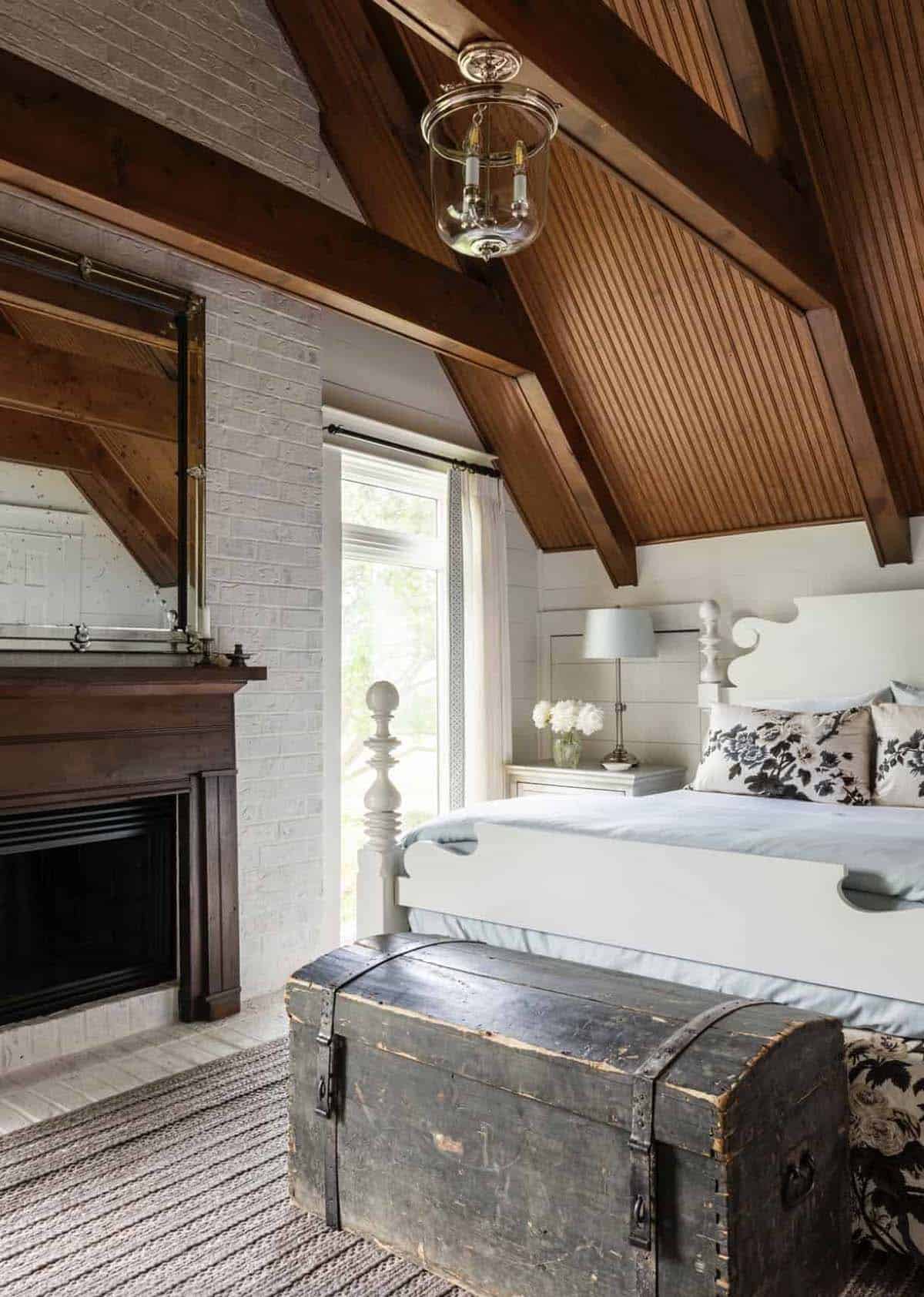 modern farmhouse style bedroom with a fireplace