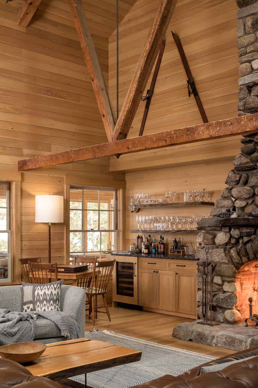 rustic modern living room with a fireplace and home bar