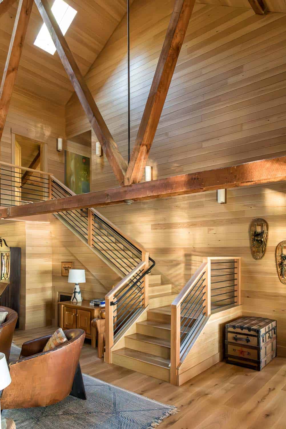 rustic modern lake house entry with a staircase