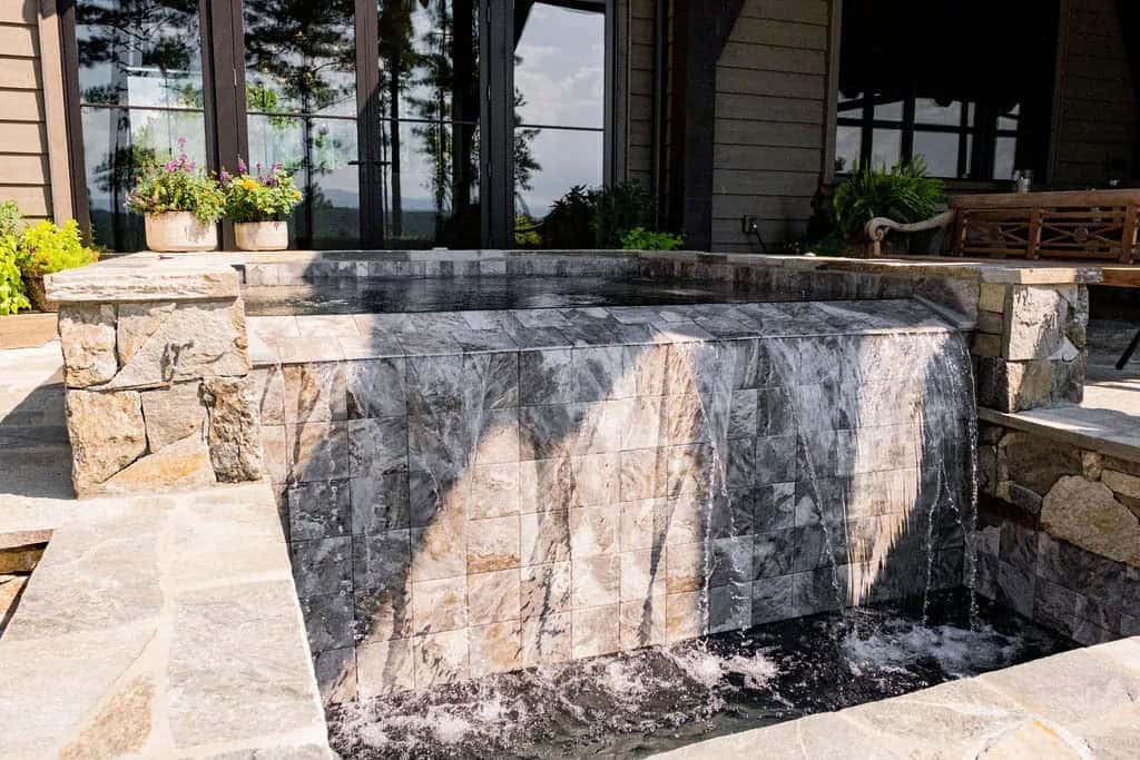 mountain home exterior with a water feature