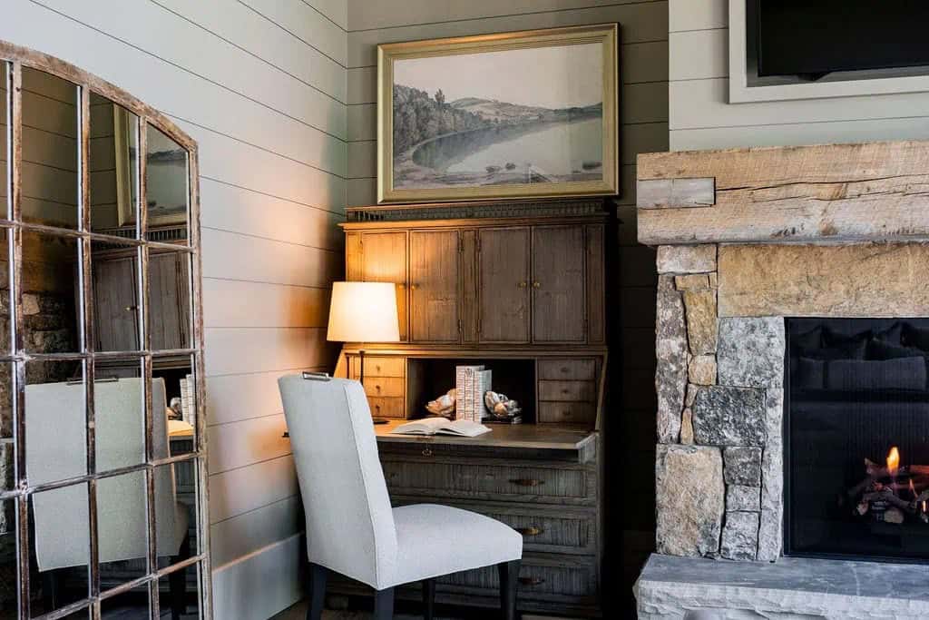 modern rustic bedroom with a work desk next to the fireplace