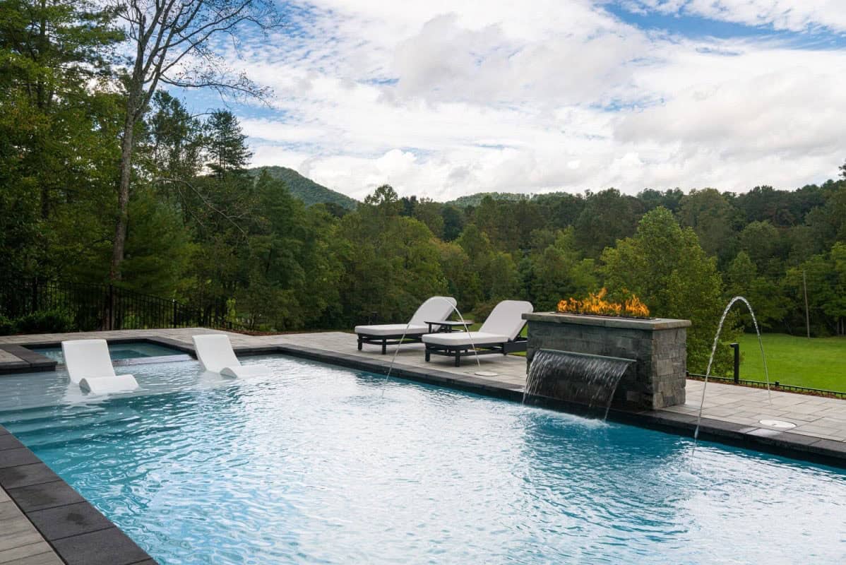 modern mountain home exterior with a pool