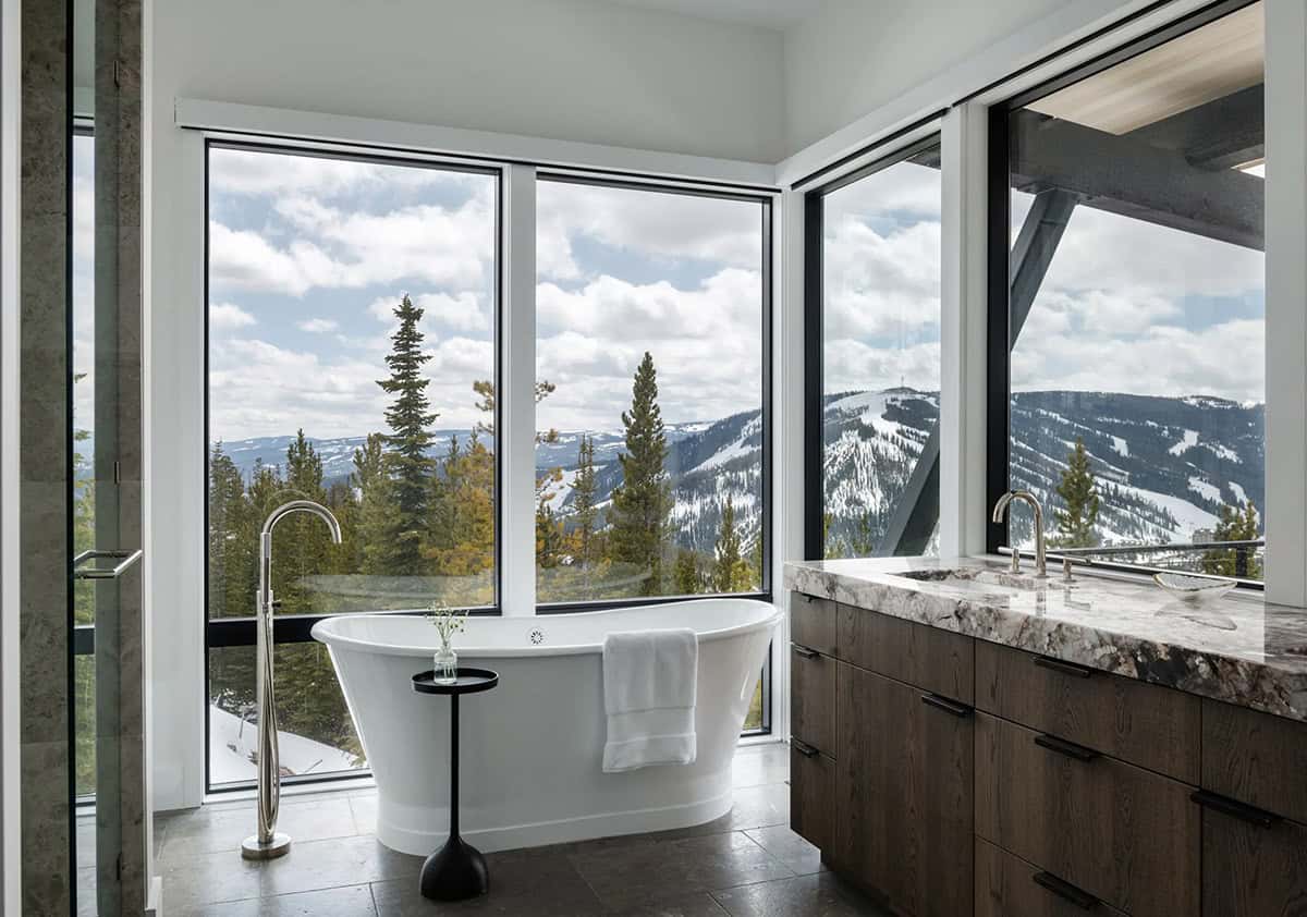 modern bathroom with a freestanding tub and large windows