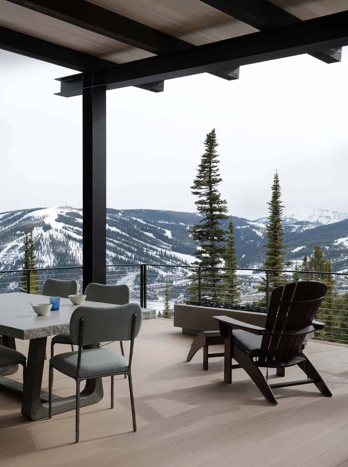 mountain home exterior patio with a view of snowy peaks