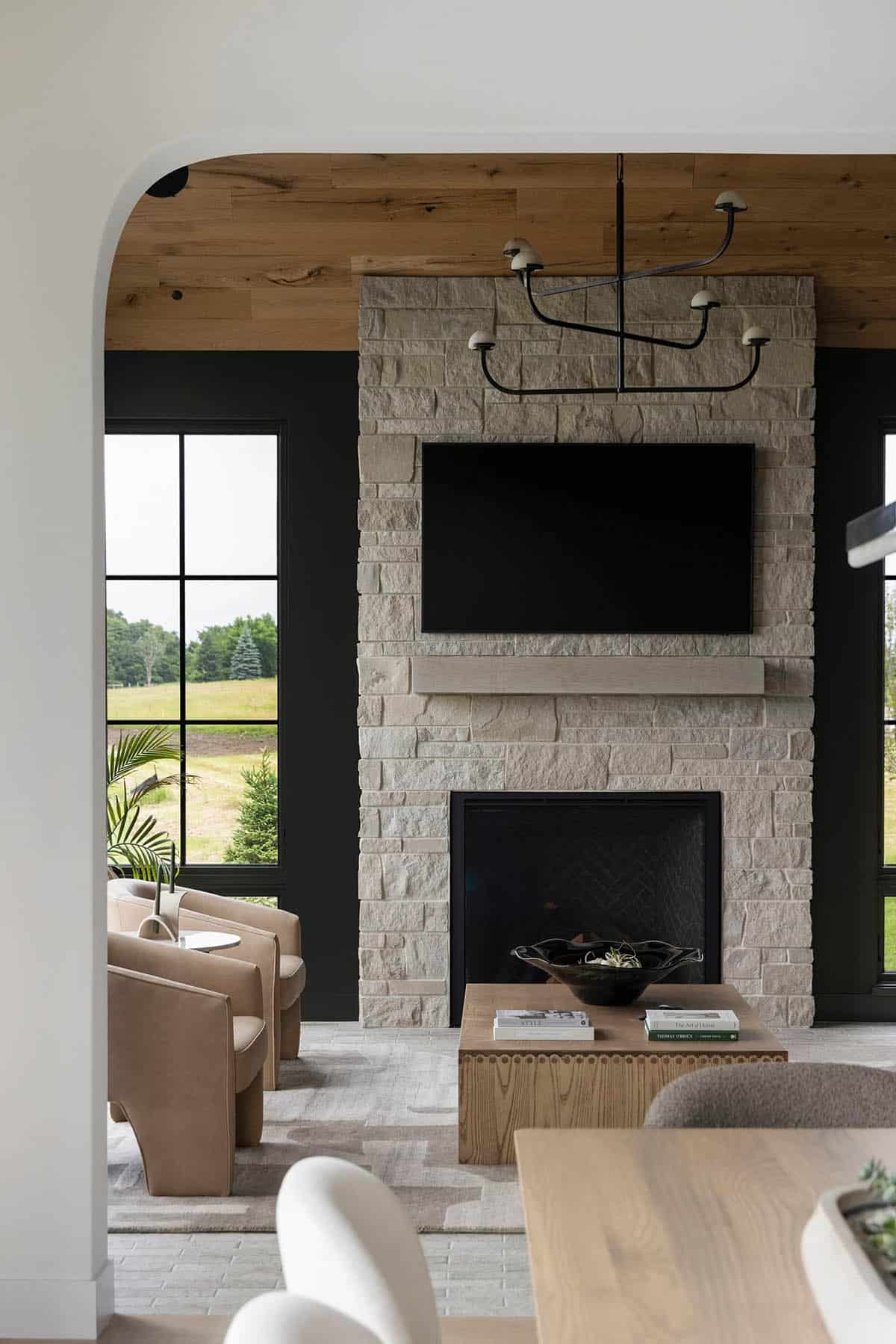 contemporary sunroom with a fireplace