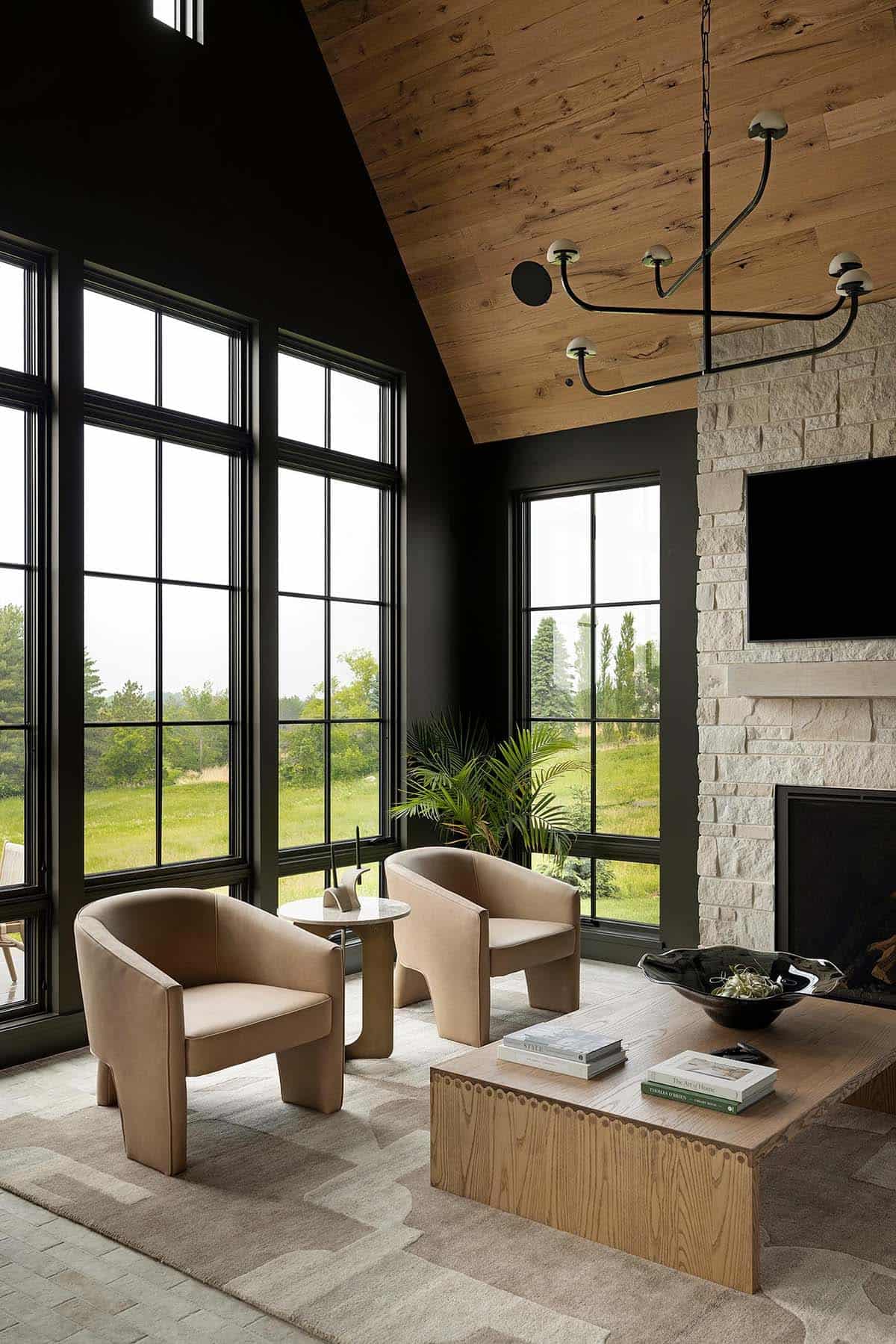 contemporary sunroom with a fireplace