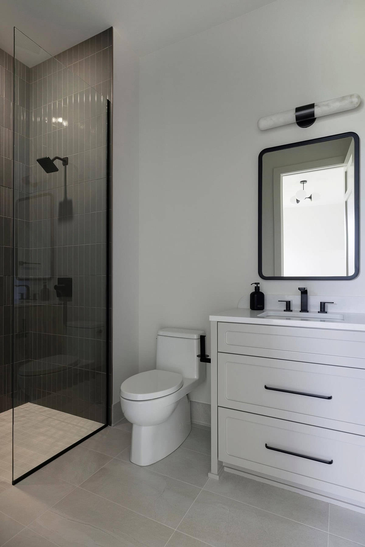 contemporary bathroom with a light in the shower