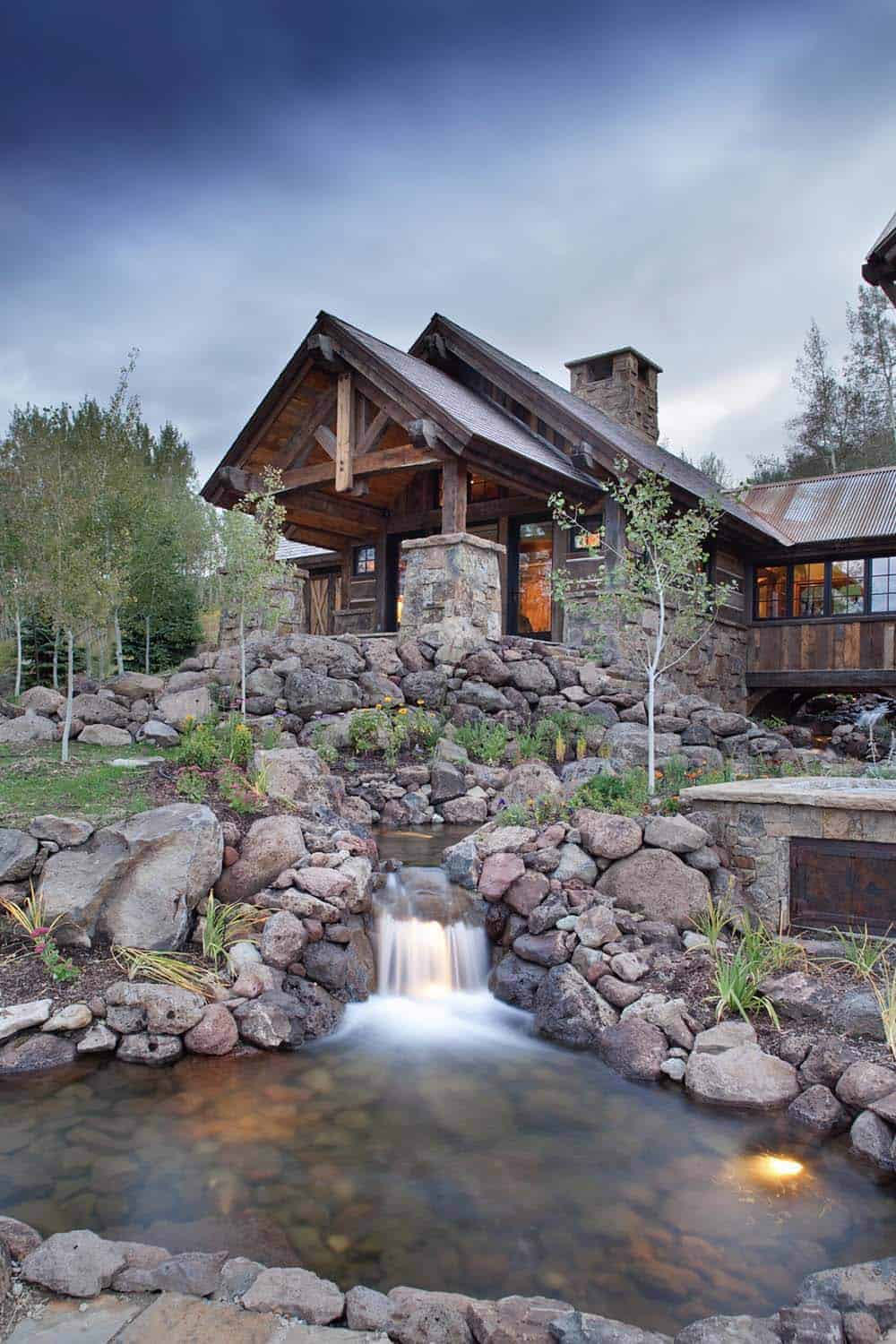 rustic mountain home exterior with a water feature
