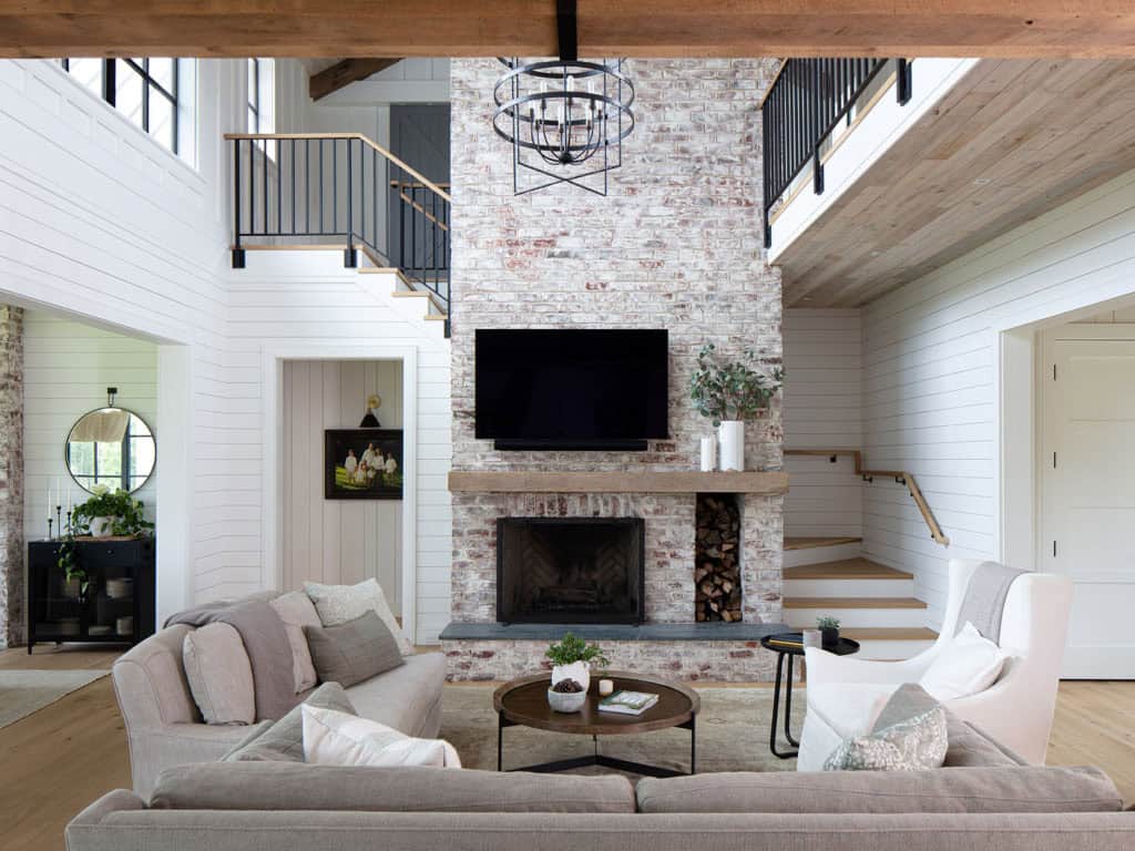 modern farmhouse living room with a fireplace