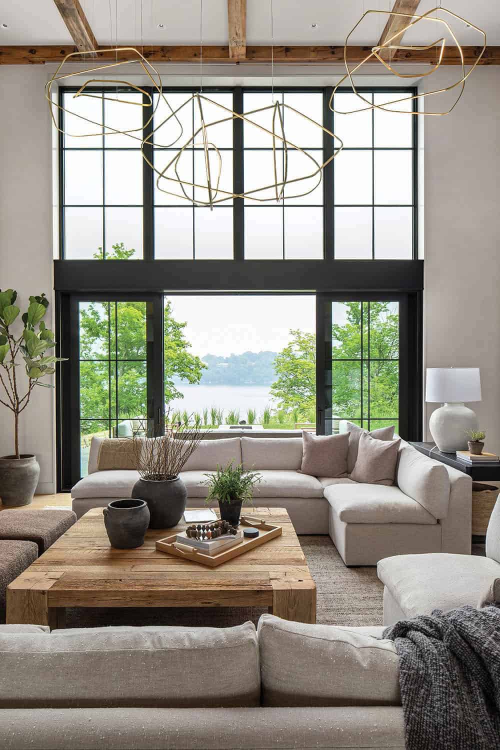 modern living room with a large window and lake views