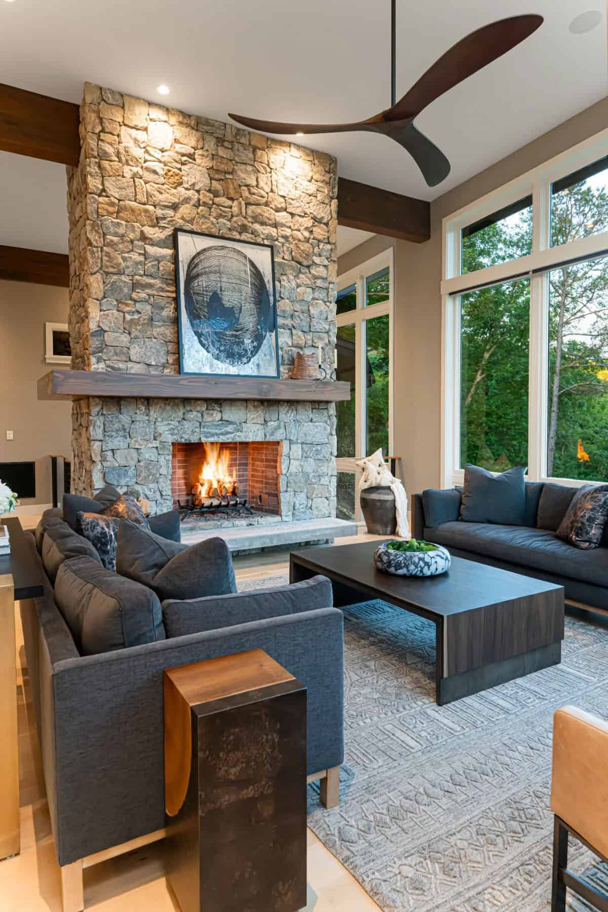 modern living room with a stone-clad fireplace