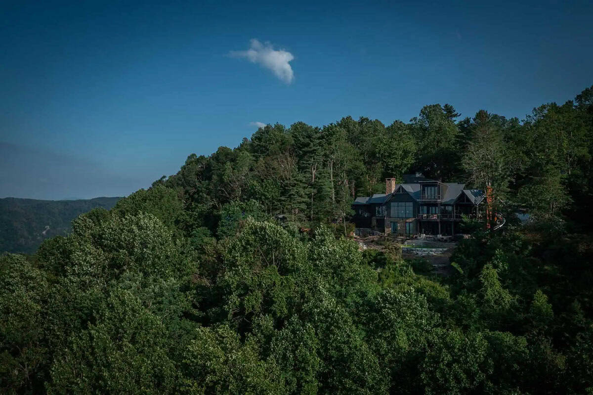 modern rustic mountain house exterior aerial view