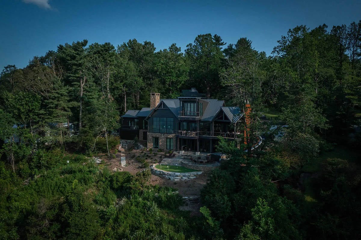 modern rustic mountain house exterior aerial view