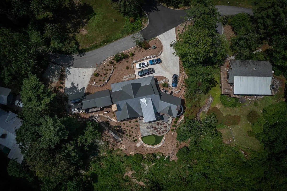 rustic mountain house exterior aerial view