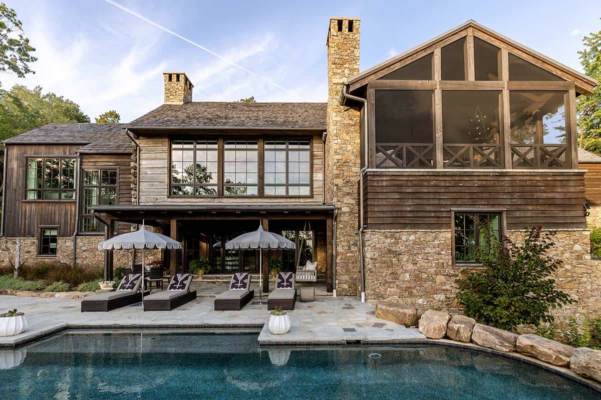modern rustic mountain house exterior with a pool