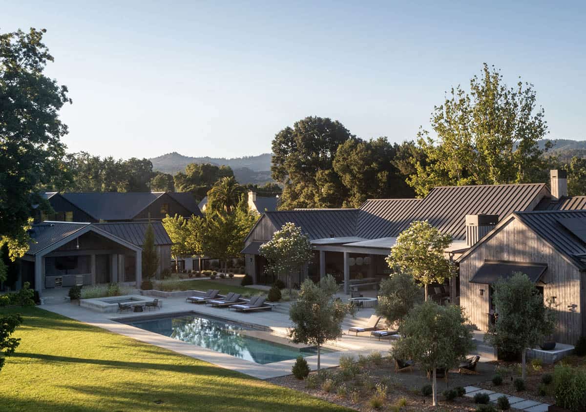 modern farmhouse exterior with a pool