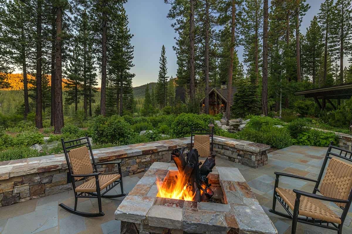contemporary mountain home exterior with a firepit