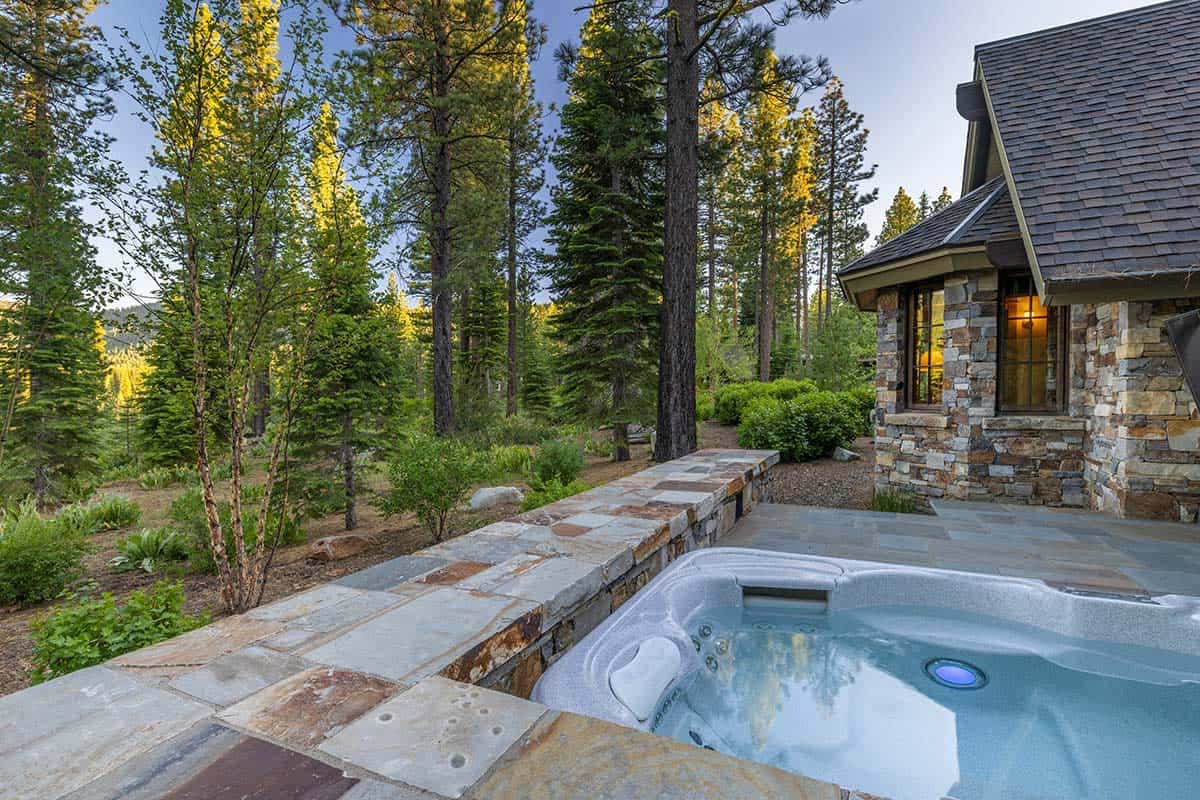 contemporary mountain home patio with a hot tub
