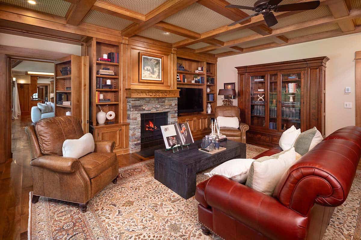 contemporary mountain style family room with a fireplace