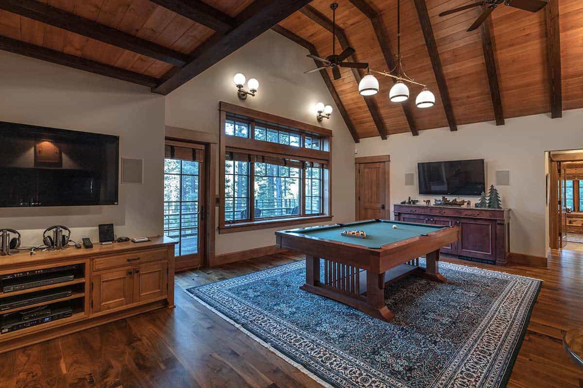 contemporary mountain style family room with a pool table