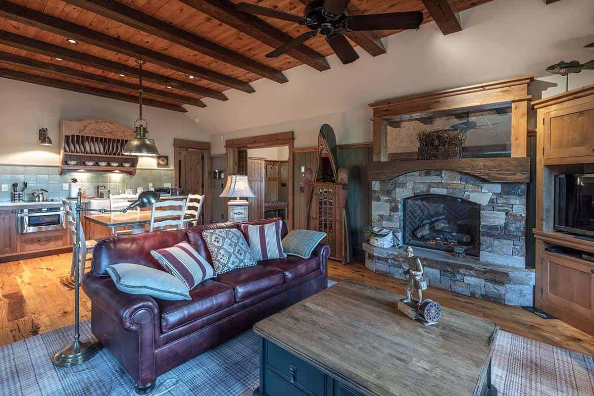 contemporary mountain style great room with a fireplace
