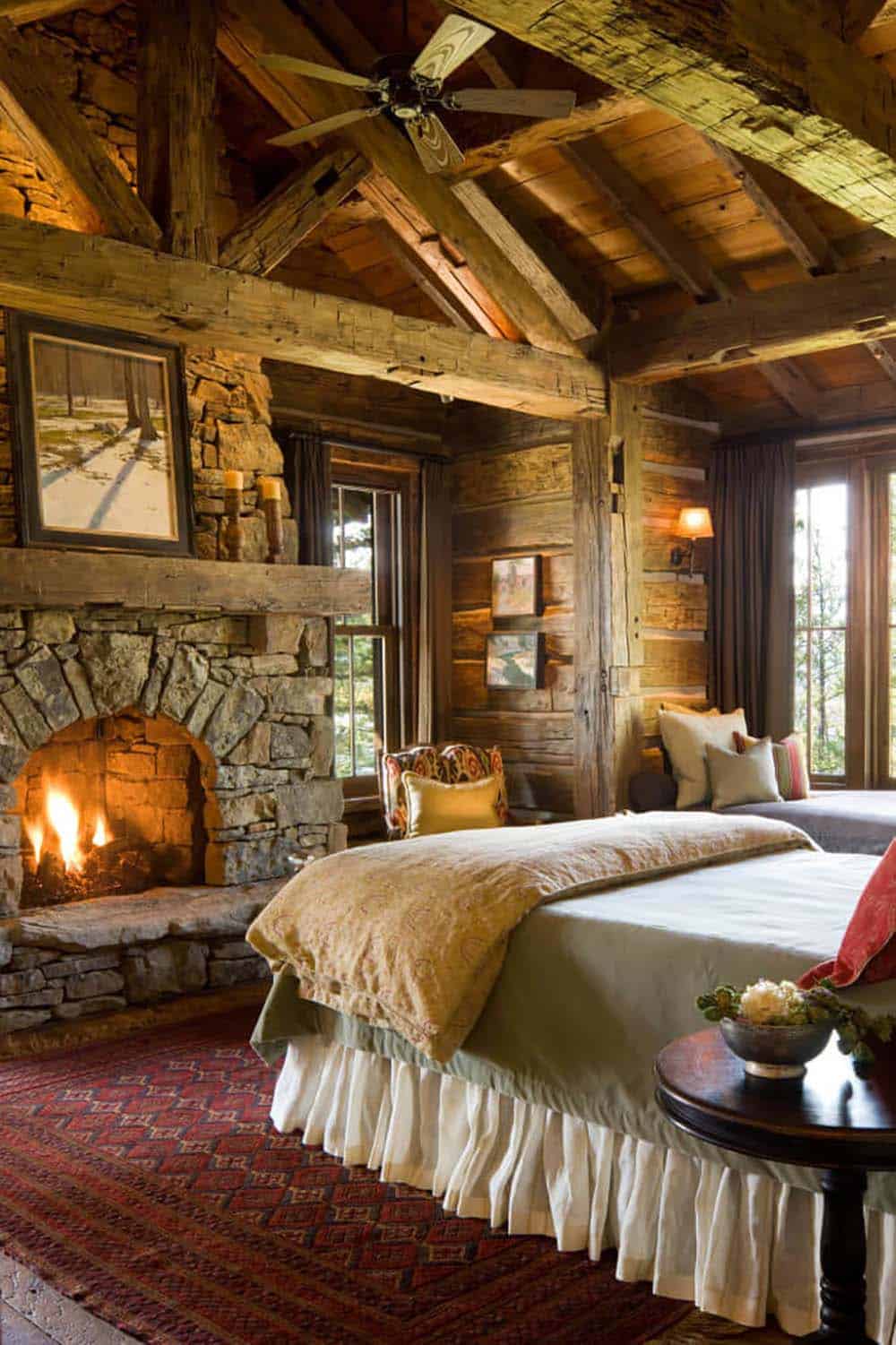 rustic bedroom with a fireplace