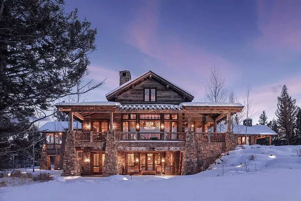 mountain home exterior with snow at dusk