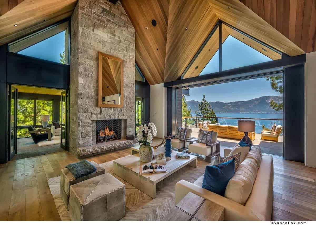modern living room with a fireplace overlooking the lake