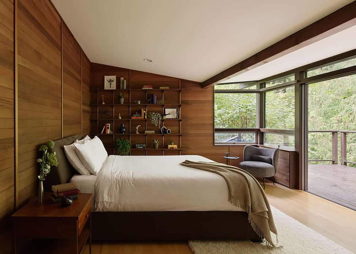 mid-century modern bedroom with large windows and a private balcony