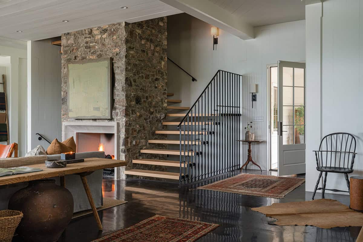 farmhouse style living room with a fireplace